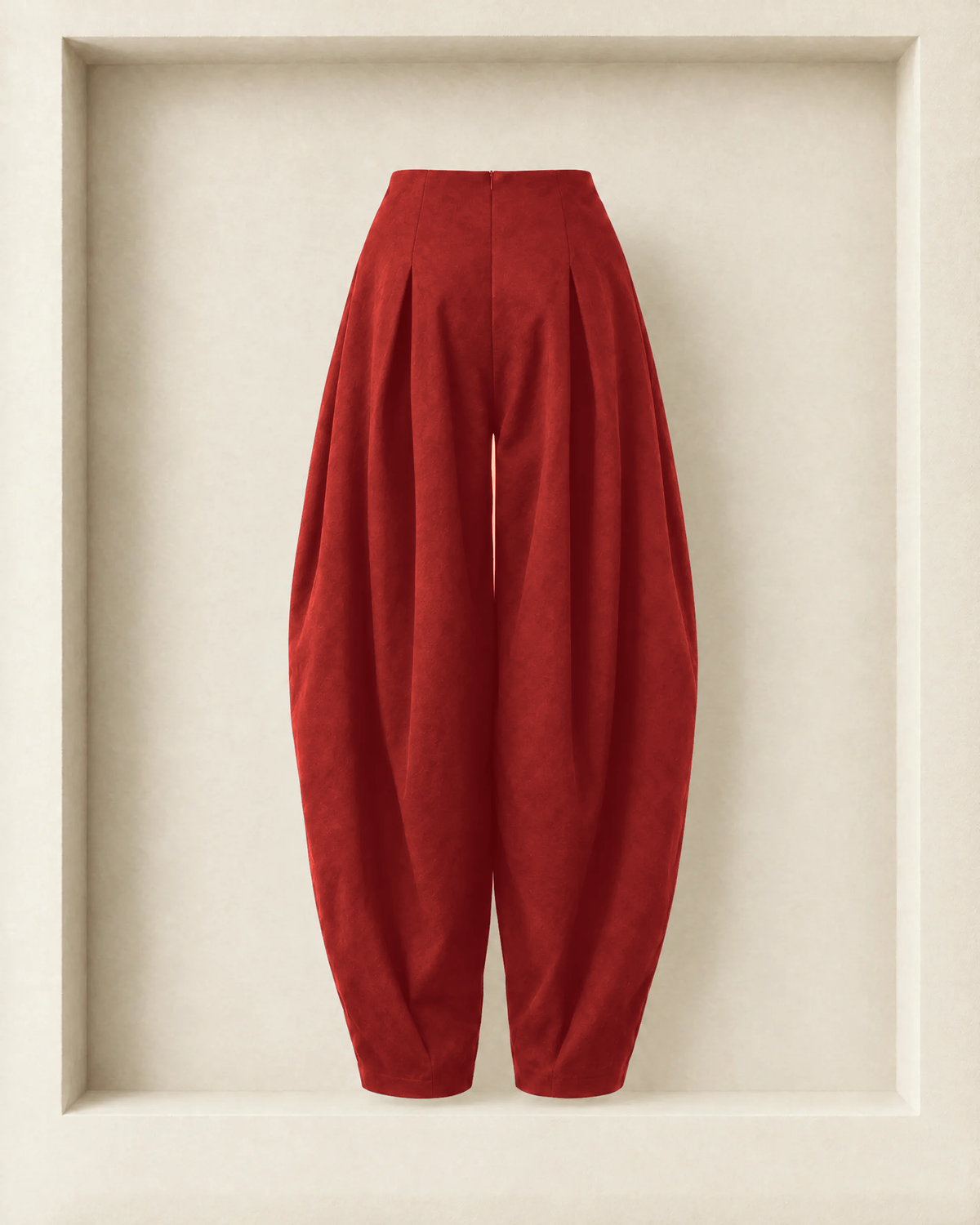 Nara Pants in burgundy, back view — centre-back zip and rounded balloon leg