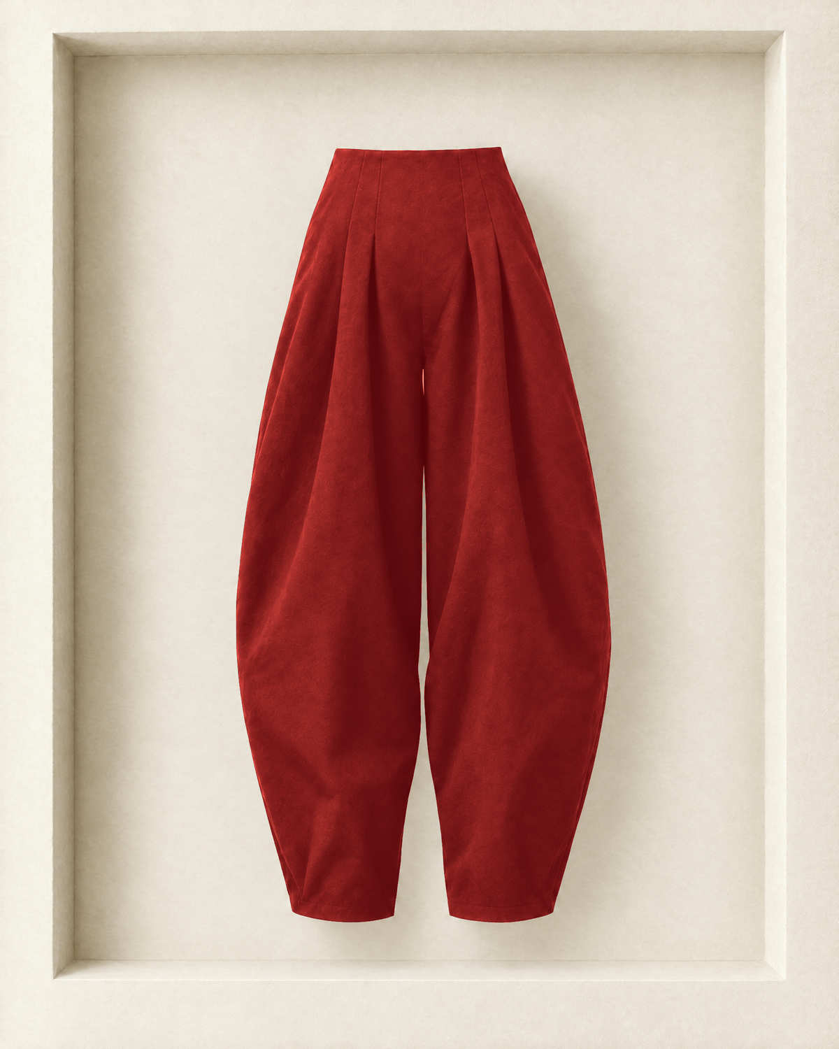 Nara Pants in burgundy, front view — waist pleats and full, rounded balloon leg