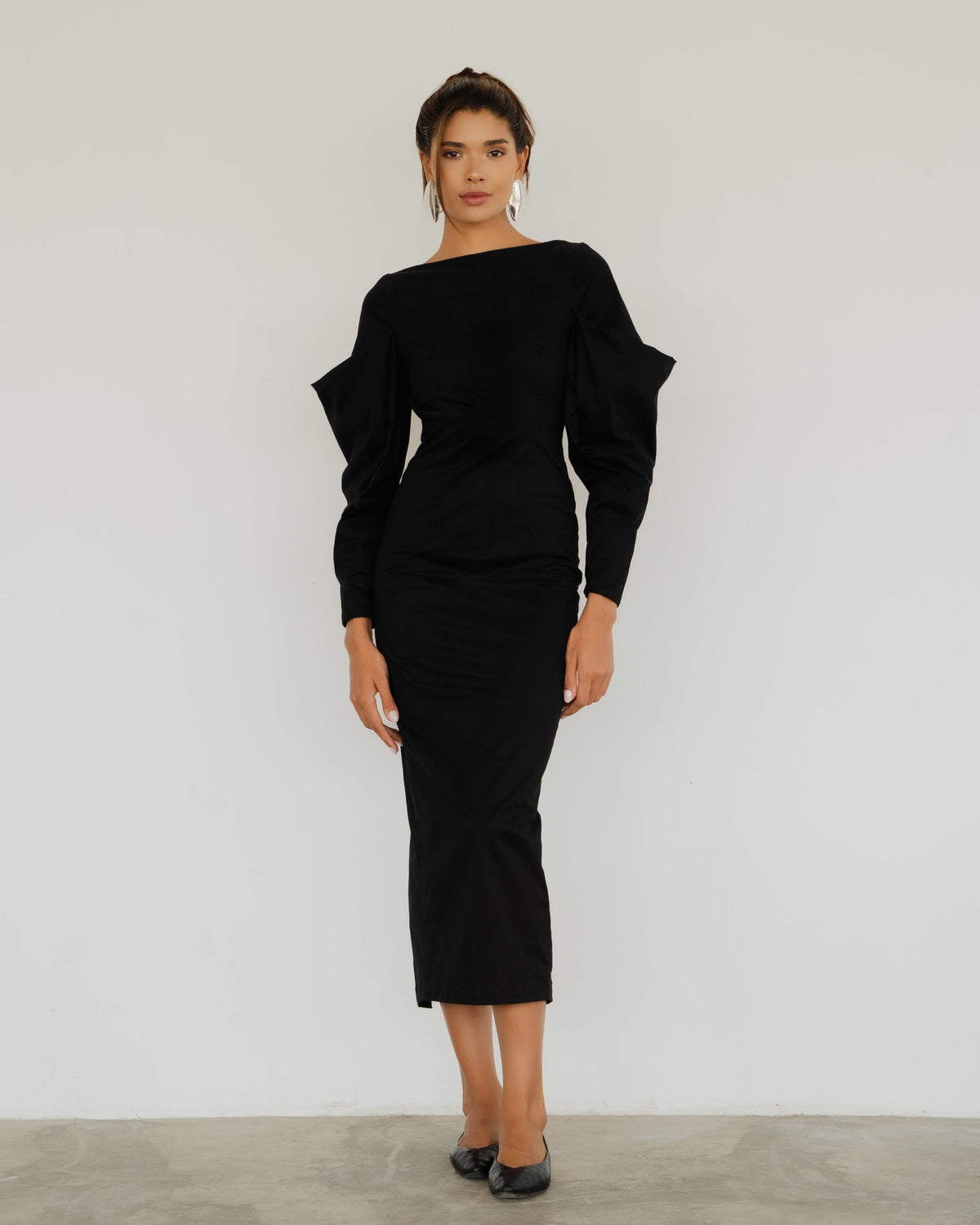 Model wearing the Seraphine Dress in black, full-length front view